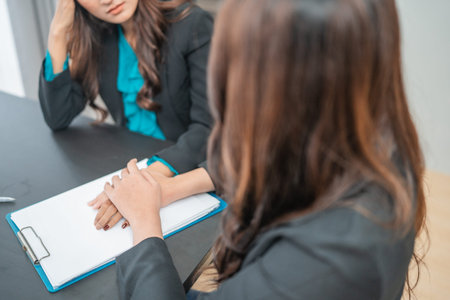 Two women engage in a focused and strategic business discussion during a meeting