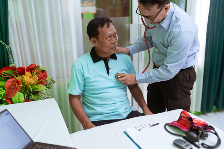 A consultation in a medical clinic where a doctor examines a patient with a stethoscope
