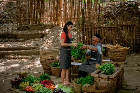 A lively local market showcasing fresh vegetables with happy interactions between friendly sellers and customersの写真素材