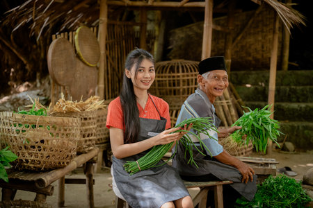 A vibrant and joyful interaction taking place in a traditional farming scene, highlighting local produce and cultureの写真素材