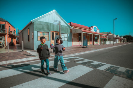 Children are enjoying a beautiful sunny day at a charming locationの写真素材
