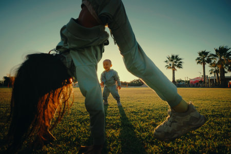 An engaging and delightful moment where two children are joyfully playing outside, showcasing the fun of childhoodの写真素材