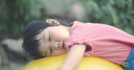Asian girls playing on the garden .の写真素材