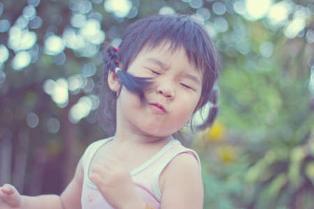 Asian girls playing on the garden .の写真素材