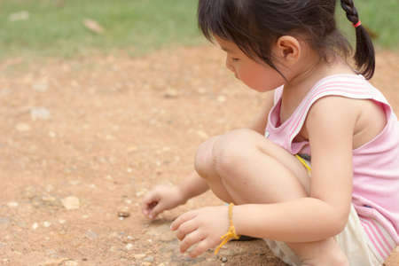 Asian girls playing on the garden .の写真素材