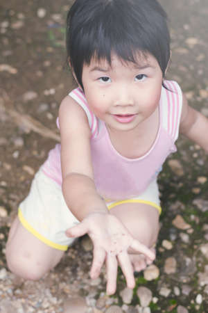 Asian girls playing on the garden .の写真素材