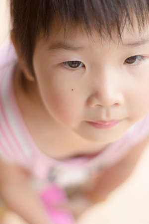 Asian girl playing on the garden.の写真素材