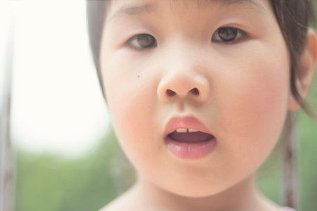 Asian girl playing on the garden.の写真素材