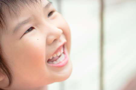 Asian girl playing on the garden.の写真素材