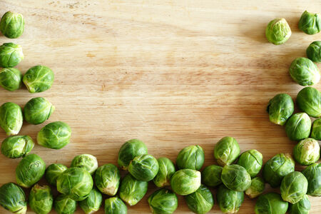 Brussels sprouts, natural, on a wooden board with space for text, may be background for vegetables, cook and eatの写真素材