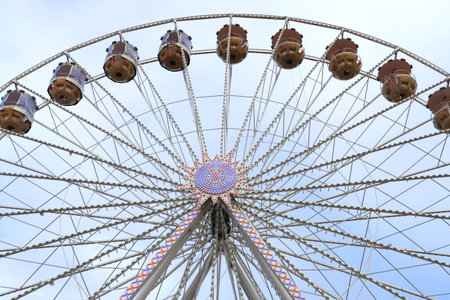 ferris wheel on a funfair against blue sky, frontal viewのeditorial素材