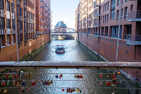 excursion boat on a canal in the Speicherstadt warehouse district in the city of Hamburg Germanyのeditorial素材