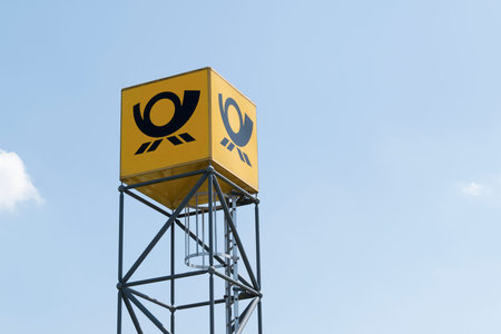 tower with the logo of the German post against the blue sky, Ratzeburg, Germany - June 12, 2015