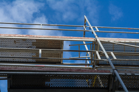 Scaffolding elements with a view in the blue skyの写真素材