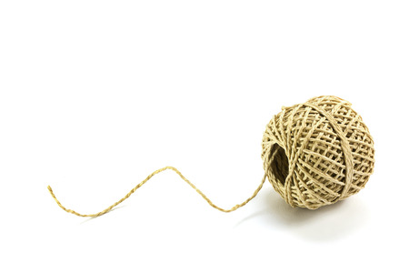 Ball of string with texture and strands isolated with shadows on a white background, copy spaceの写真素材