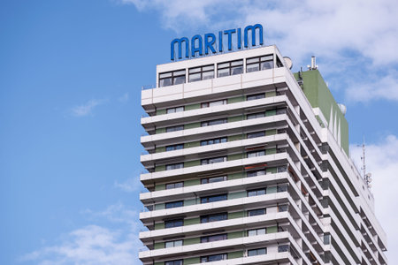 Luebeck Travemuende, Germany - September 30, 2016: Maritim skyscraper, the wellknown hotel right on the beach  in Travemuende on the Baltic Sea against the blue sky with clouds, copy spaceのeditorial素材