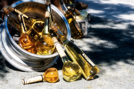 SCHWERIN, GERMANY, JUNE 2, 2017: Bottles with homemade wine on the street food festival market on a sunny weekend in the cityのeditorial素材