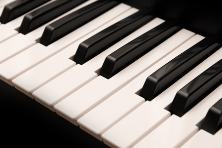 Classic grand piano keyboard with black and white keys as a music background, selected focus, narrow depth of fieldの写真素材