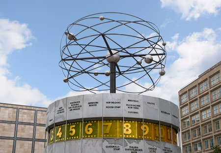 Urania World Clock with planets against a blue sky in the public square of Alexanderplatz in Mitte,...