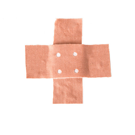 plaster in cross shape isolated on a white background, copy spaceの写真素材