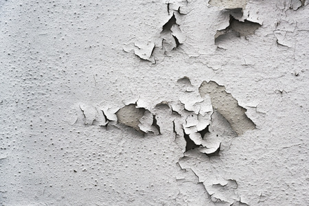 flaking gray paint on an old building, background texture for renovation concept, copy spaceの写真素材