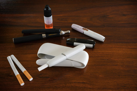 different smoke systems in comparison, normal cigarette, tobacco heater with sticks and e-cigarette...