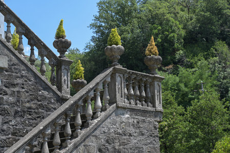 Staircase with stone columns and plant pots at the corners, typical historical garden design in...