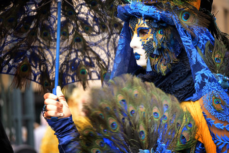 Hamburg, Germany, February 08, 2020: Female mask with peacock feathers at the carnival celebration Maskenzauber, that means Magic Masks, a street festival in Hamburg on the Alster as a tribute to the original event in Venice, selected focusのeditorial素材