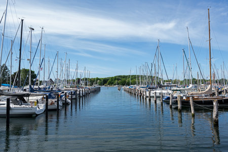 Travemuende, Germany, May 28, 2020: Famous Baltic Sea marina with a lot of berths and a lot of sailing boats in the water against a blue sky with copy spaceのeditorial素材