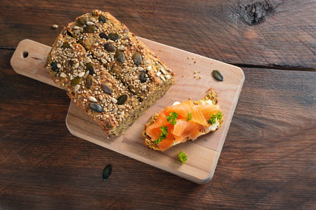 Healthy slimming with low carb or ketogenic diet, protein bread and sandwich with salmon and herb...