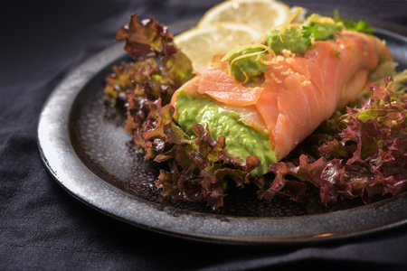 Organic onions freshly peeled in a bowl on a white painted table, healthy cooking at home during the coronavirus pandemic, copy space, high angle view from above, selected focusの写真素材