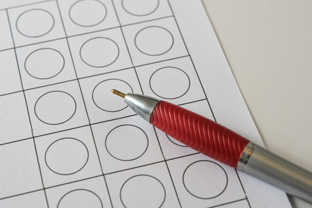 Empty paper form with selection boxes and a ballpoint pen, business application questionnaire or...