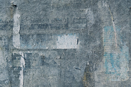 Abstract grunge background texture of a surface from an old weathered bulletin board with remnants...
