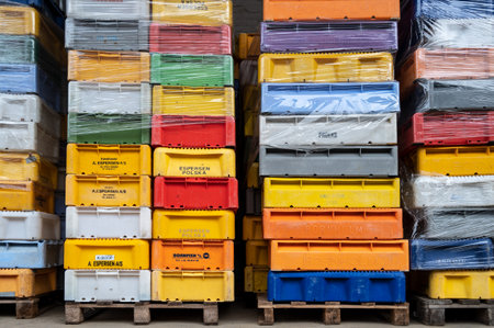 Sassnitz, Germany, August 20, 2020: Stacks of colorful plastic boxes delivered from fishermen of different countries to the fish manufacture factory in Sassnitz on the Baltic Sea island Rugen, selected focusのeditorial素材