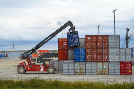 Sassnitz-Mukran, Germany, August 20, 2020: Shunting vehicle moves containers in the industrial cargo port of Sassnitz Mukran on the island of RÃ¼gen in the Baltic Sea, copy space, selected focusのeditorial素材