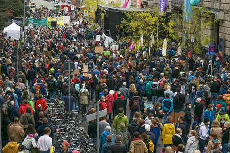 Lubeck, Germany, September 24, 2021: Masses of people coming to the rally for the global Fridays for Future demonstration march to protest against climate change, selected focusのeditorial素材