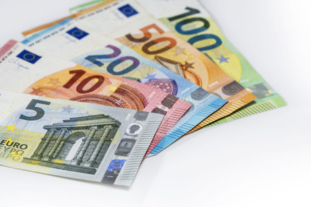 Some banknotes in euro currency on a light gray background, finance concept, copy space, selected...
