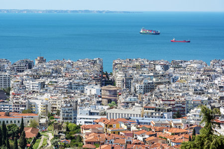 Thessaloniki city, aerial panoramic view over the houses, the tower Rotunda of Galerius and the blue Mediterranean Sea on a sunny day, capital of Macedonia in Greece, copy space, selected focusの写真素材