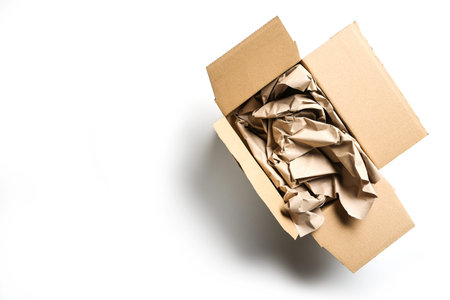 Large packaging for small goods on white, without plastic but natural cardboard box and a lot of...