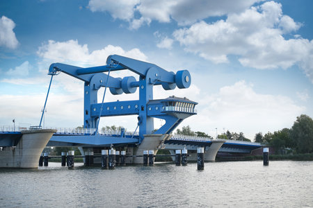 Bascule bridge in Wolgast called Blaues Wunder (blue miracle), combined road and railroad bridge over the Peene river connecting the mainland in Mecklenburg-Western Pomerania with the island of Usedomの写真素材