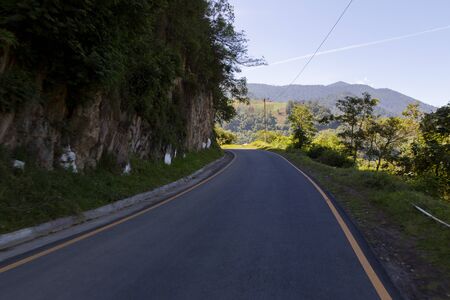 Small road surrounded by trees and nature in Guatemalaの写真素材