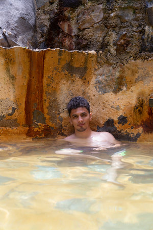 Hispanic Hispanic man in hot springs relaxing in Guatemalaの写真素材