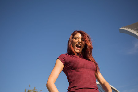 Redheaded girl posing as a hipster.