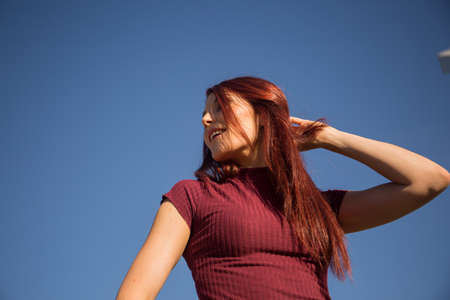 Redheaded girl posing as a hipster.の写真素材