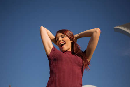 Redheaded girl posing as a hipster.の写真素材