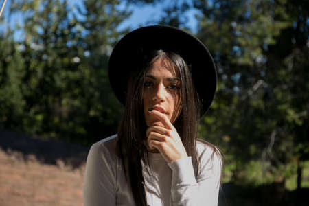 hipster girl posing in a balconyの写真素材