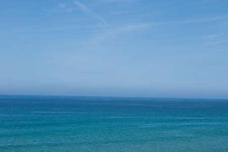 blue sunny sky between the horizion seaの写真素材