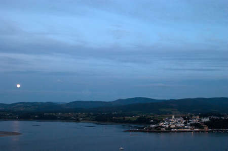 moon on nice villageの写真素材