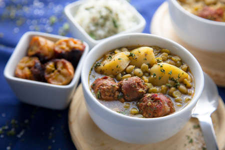Delicious stew of peas, potatoes and chorizoの写真素材