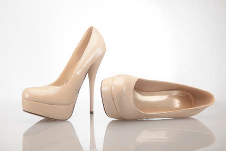Nude high heel women shoes on white backgroundの写真素材